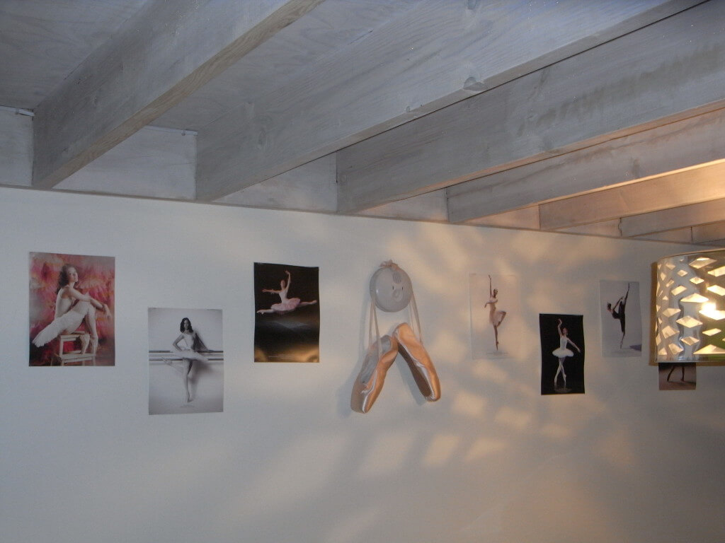 Exposed beams in the dining area - and a glimpse of my pendant light (the art work is a temporary stop gap!)