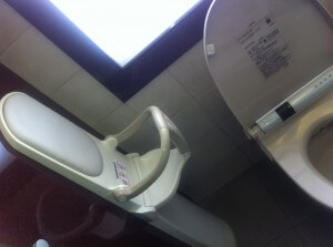 Baby seat in the toliet cubicle