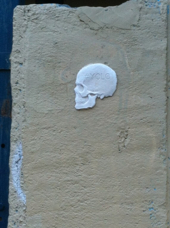 White skull, YOLO - similar to the one on the parking sign