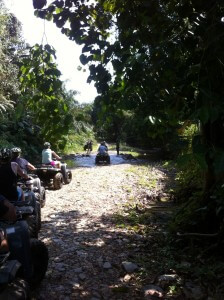 ATV riding through a stream