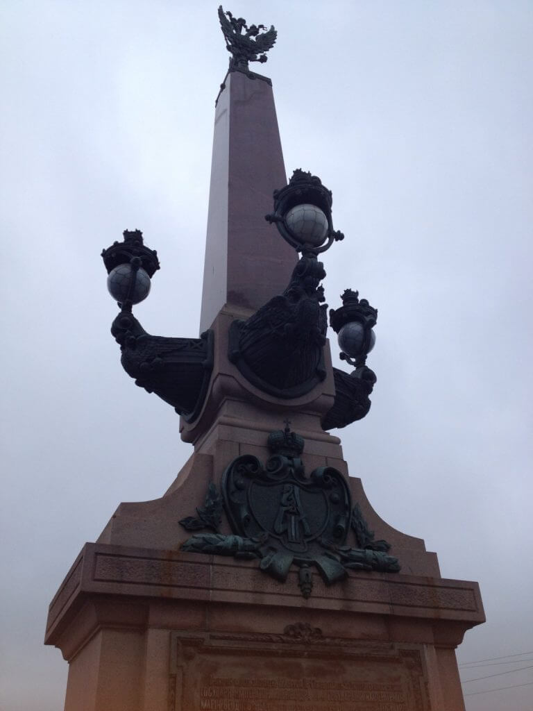 Ornate bridge's street light columns, which contrast others